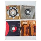 Four Assorted Vinyl Records with Sleeves