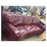 Curved Red Leather Sofa with Three Cushions