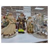 Four Santa Claus Figurines