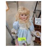 Porcelain Doll with Blonde Hair and Blue Dress