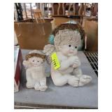 Two Angel Figurines With Floral Accents