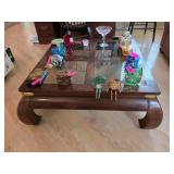 Glass-Top Wooden Coffee Table With Decor