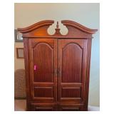 Wooden Armoire With Ornate Crown