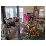 Teacups, Saucers, and Miniature Tea Set