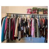 Large Assortment of Womenï¿½s Clothing on Hangers
