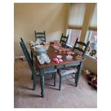 Wooden Table with Four Chairs Featuring Green Acce