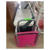 Pink Folding Chair and Green Igloo Cooler