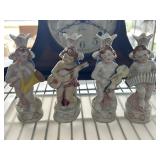 Four Hand-Painted Cherub Figurines with Instrument