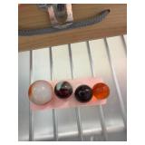 Four Mixed Marbles on Display Card