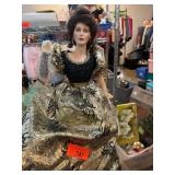 Porcelain Doll With Black and Gold Gown