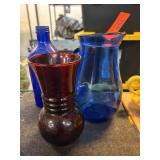 Three Colored Glass Containers