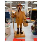 Wooden Figure of a Man Holding Pipe and Basket