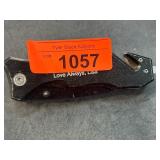 Folding Knife with Black Handle and Serrated Blade