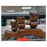 Carved Wooden Owl Sculpture on a Branch