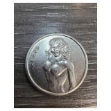 Novelty Coin Featuring Double-Sided Female Figure