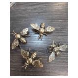 Four Metal Bee Sculptures