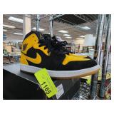 Air Jordan 1 Mid Black and Yellow Sneakers