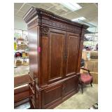 Wooden Armoire with Carved Details and Shelving
