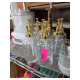 Glass Bottles With Gold-Colored Pumps