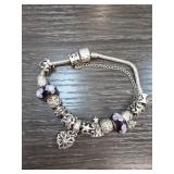 Silver-Toned Charm Bracelet with Decorative Beads