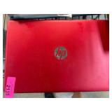HP Laptop with Red Exterior and Silver Keyboard