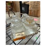 Four Apothecary Jars with Metal Basket