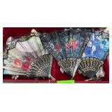 Three Decorative Folding Fans with Floral Motifs