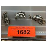 Three Metal Figurine Pins with Unique Designs