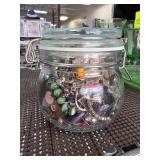 Glass Jar Filled with Assorted Jewelry