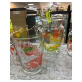 Two Clear Glass Water Pitchers