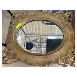 Ornate Oval Gilt-Framed Wall Mirror