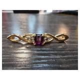 Gold-Tone Brooch with Purple Stone and Clear Accen