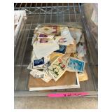 Postage Stamps on Paper in a Tray