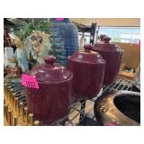 Three Burgundy Ceramic Canisters