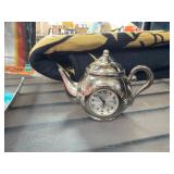 Teapot-Shaped Clock Figurine With Ornate Design
