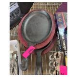Cast Iron Skillets with Wooden Trivets