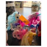 Four Colorful Toy Unicorns