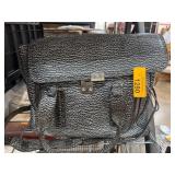 Black and White Patterned Handbag with Silver Hard