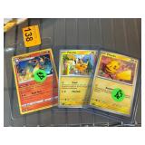 Three Pokemon Trading Cards Including Charizard