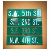 Four Green Metal Street Signs