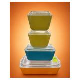 Four Multicolored Pyrex Refrigerator Dishes