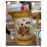 Ceramic Pitcher With Floral Basket Design