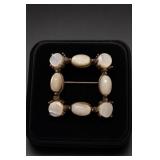 Unmarked Rectangular Brooch with Eight Inserts