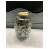 GLASS JAR WITH HANDLE HAS BUTTONS INSIDE