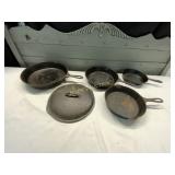 4 CAST IRON FRYING PANS WITH ONE LID