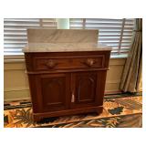 Wood Cabinet With Marble Top and Backsplash