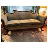 Wood-Framed Sofa with Green Upholstery and Scrolle