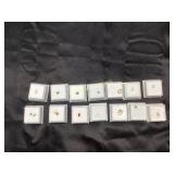 Collection of Loose Gemstones in Display Boxes