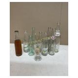 9 ASSORTED BOTTLES AND NEW CASTLE GLASS