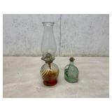 Glass Oil Lamp and Embossed Green Glass Bottle Glass Oil Lamp and Embossed Green Glass Bottle
